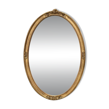 Oval mirror in carved wood