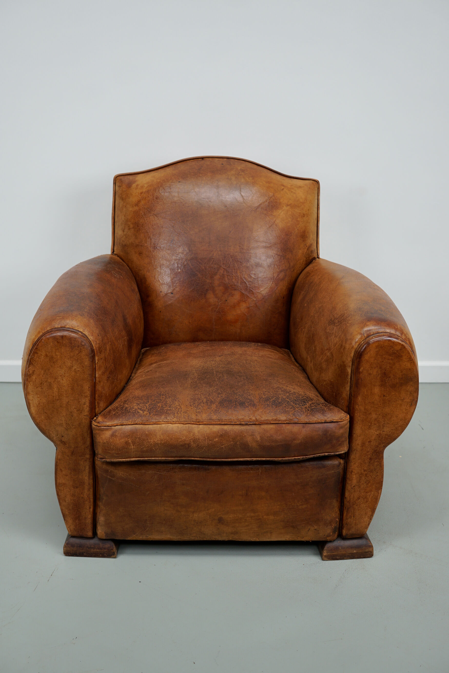 French moustache back cognac-colored leather club chair, 1940s