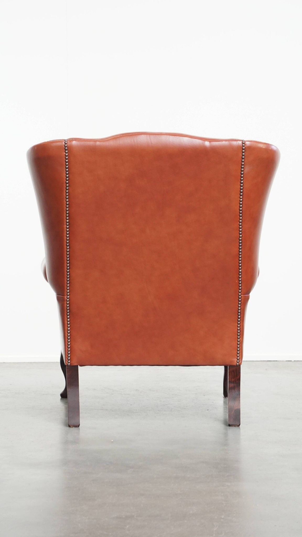 Elegant smooth English cowhide leather Chesterfield wingback armchair