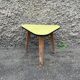 Small triangular paneling small yellow coffee table tripode door midcentury plant 1950 old