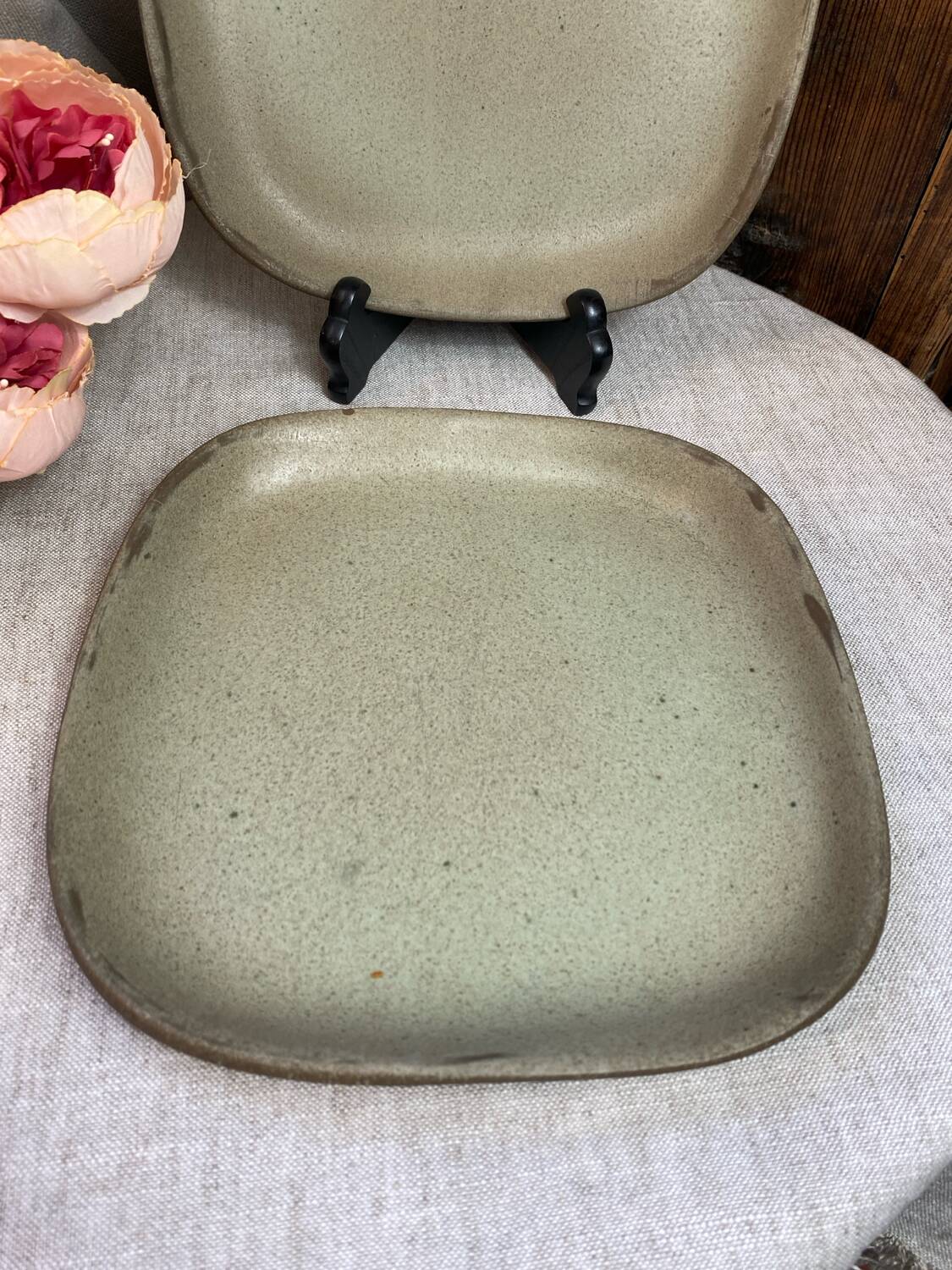 Two gray stoneware plates