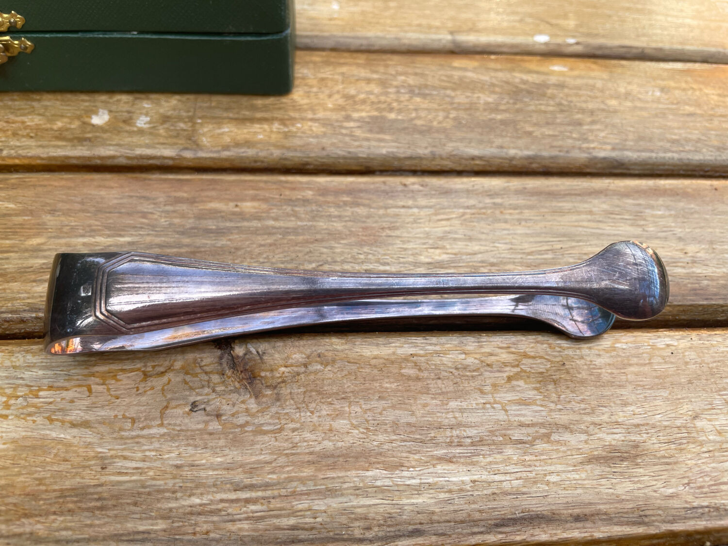 Sugar tongs in silver metal