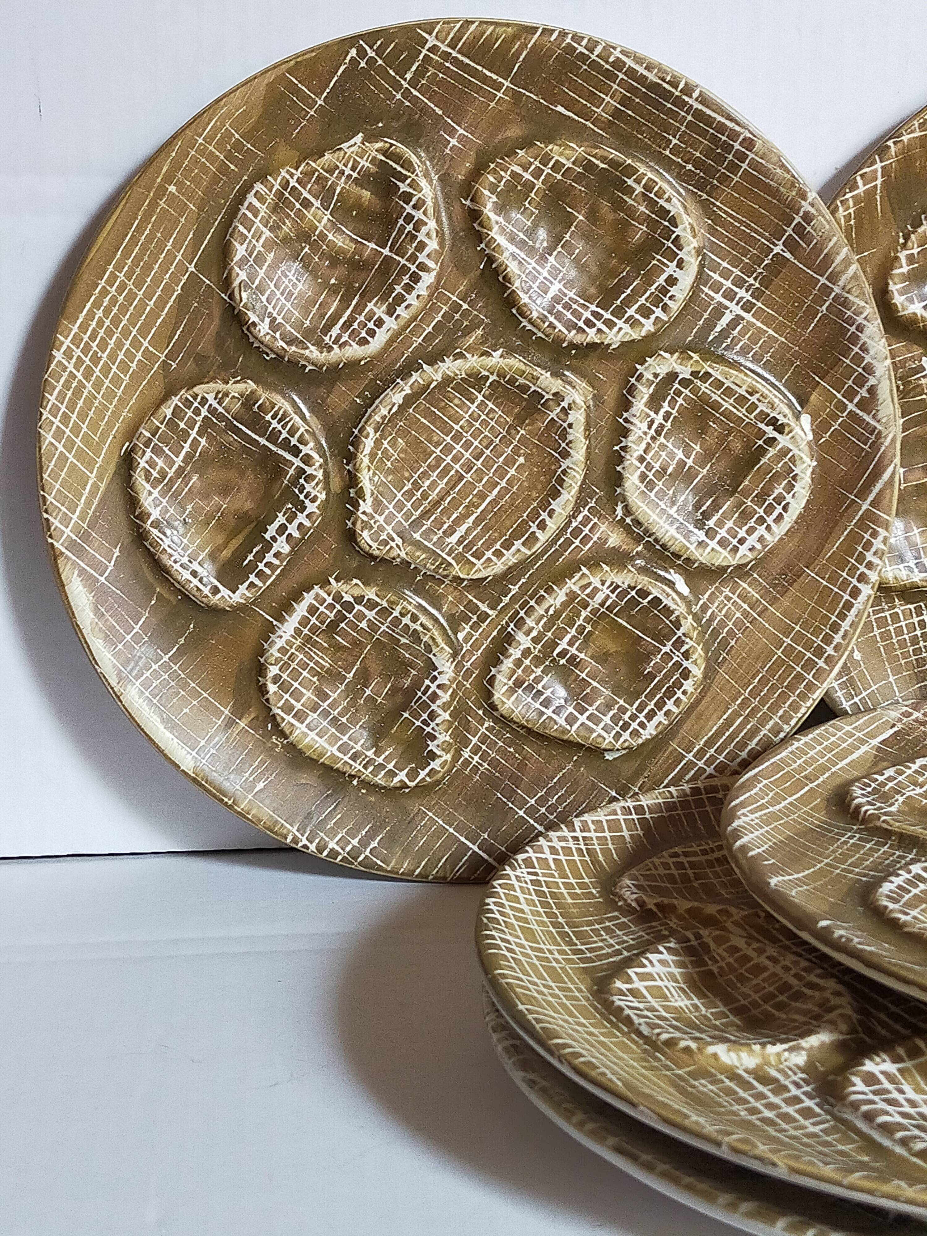 Six oyster plates earthenware with matte enamel, 50s