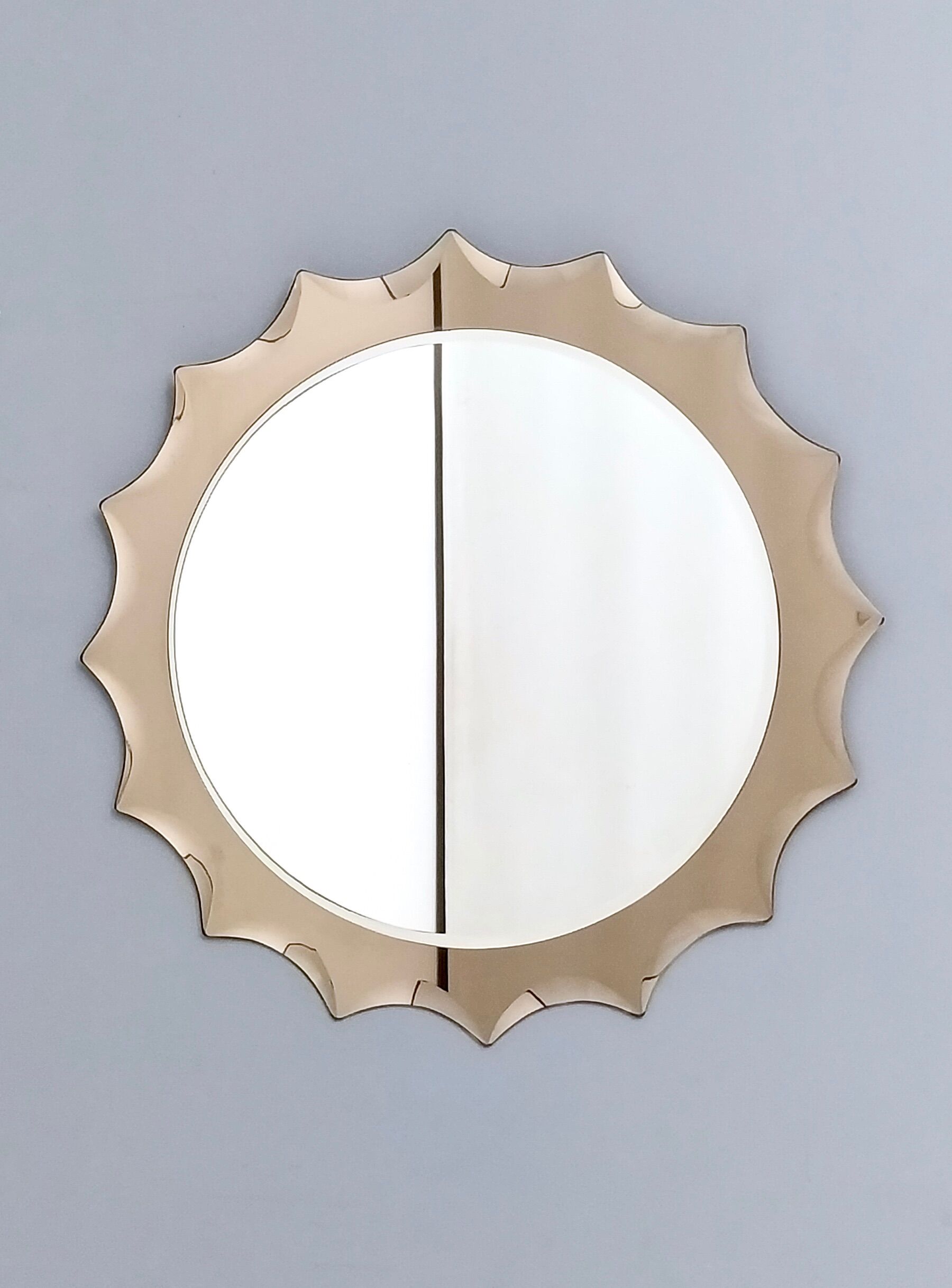 Postmodern sun shaped bronze wall mirror, italy