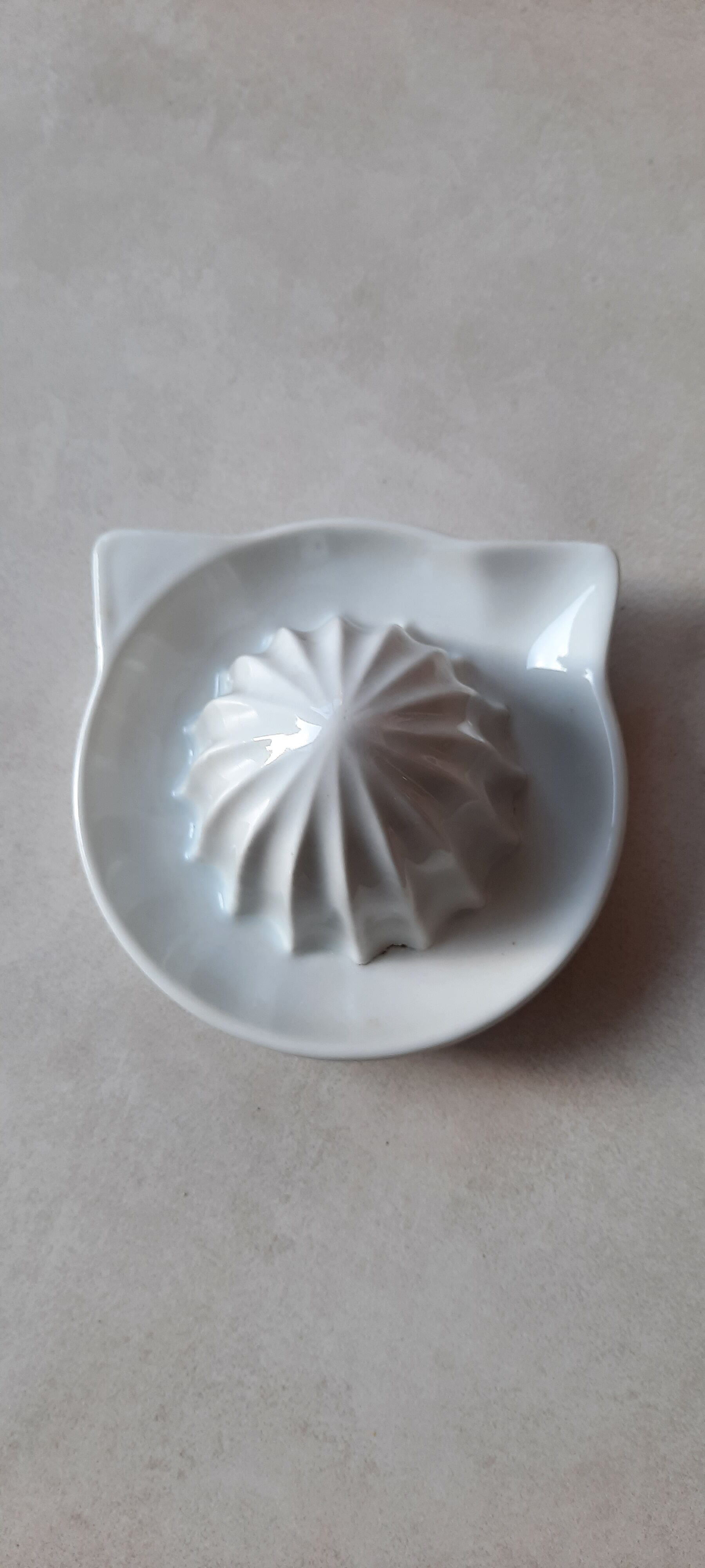 White earthenware citrus press
