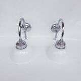 Swan neck and white glass wall lights