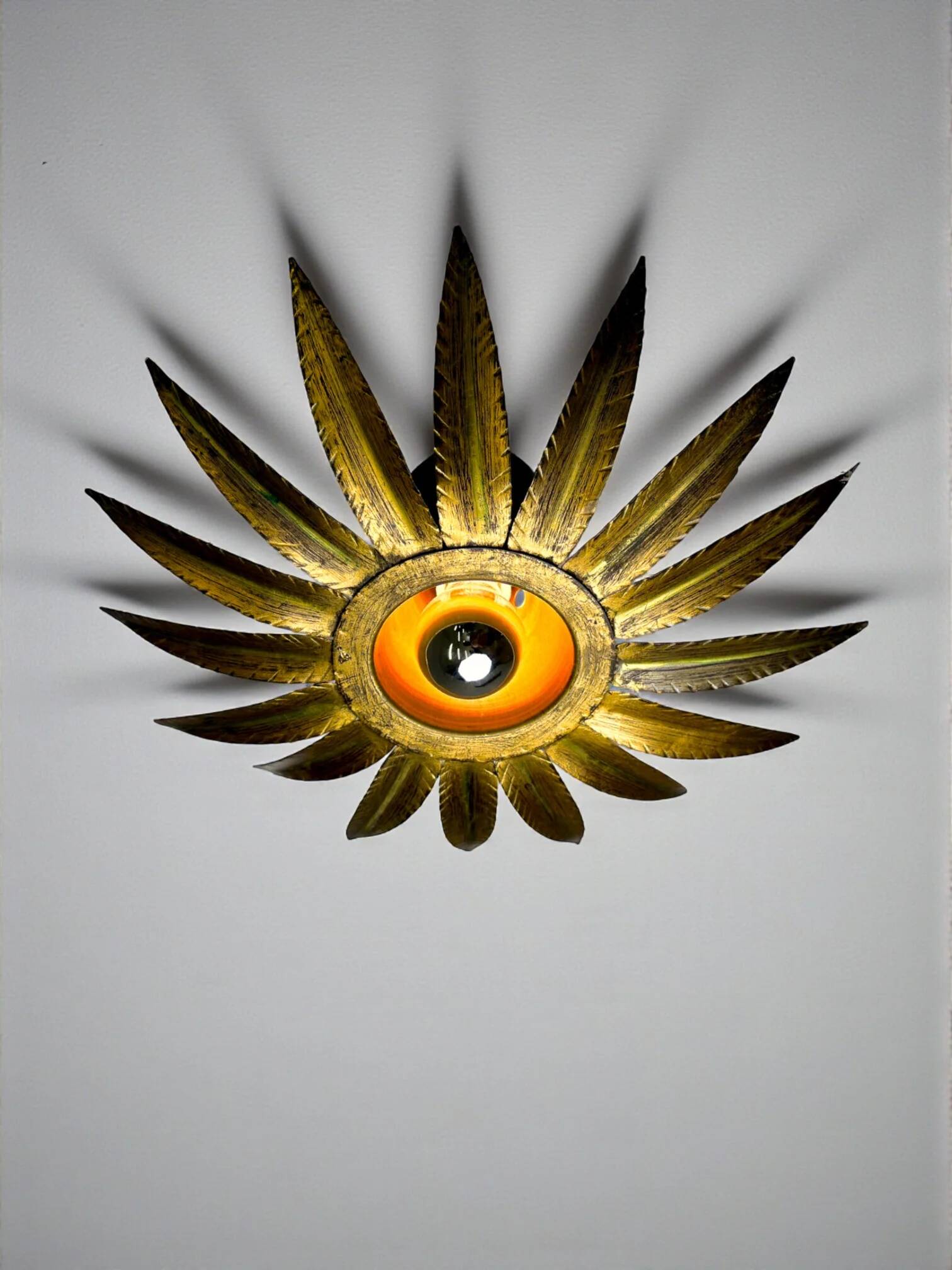 Spanish sunburst flush mount light fixture in gilt iron, Ferro Art, 1960s