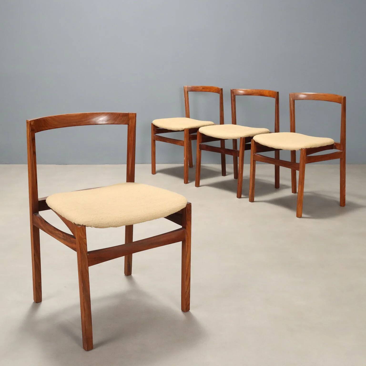 Vintage lounge chairs in exotic wood and fabric, 1960s design.