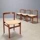 Vintage lounge chairs in exotic wood and fabric, 1960s design.
