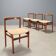 Vintage lounge chairs in exotic wood and fabric, 1960s design.