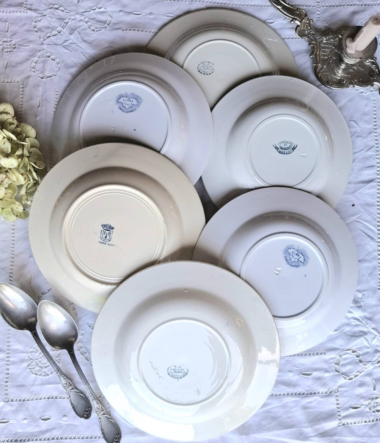 Antique mismatched earthenware soup plates with a tureen