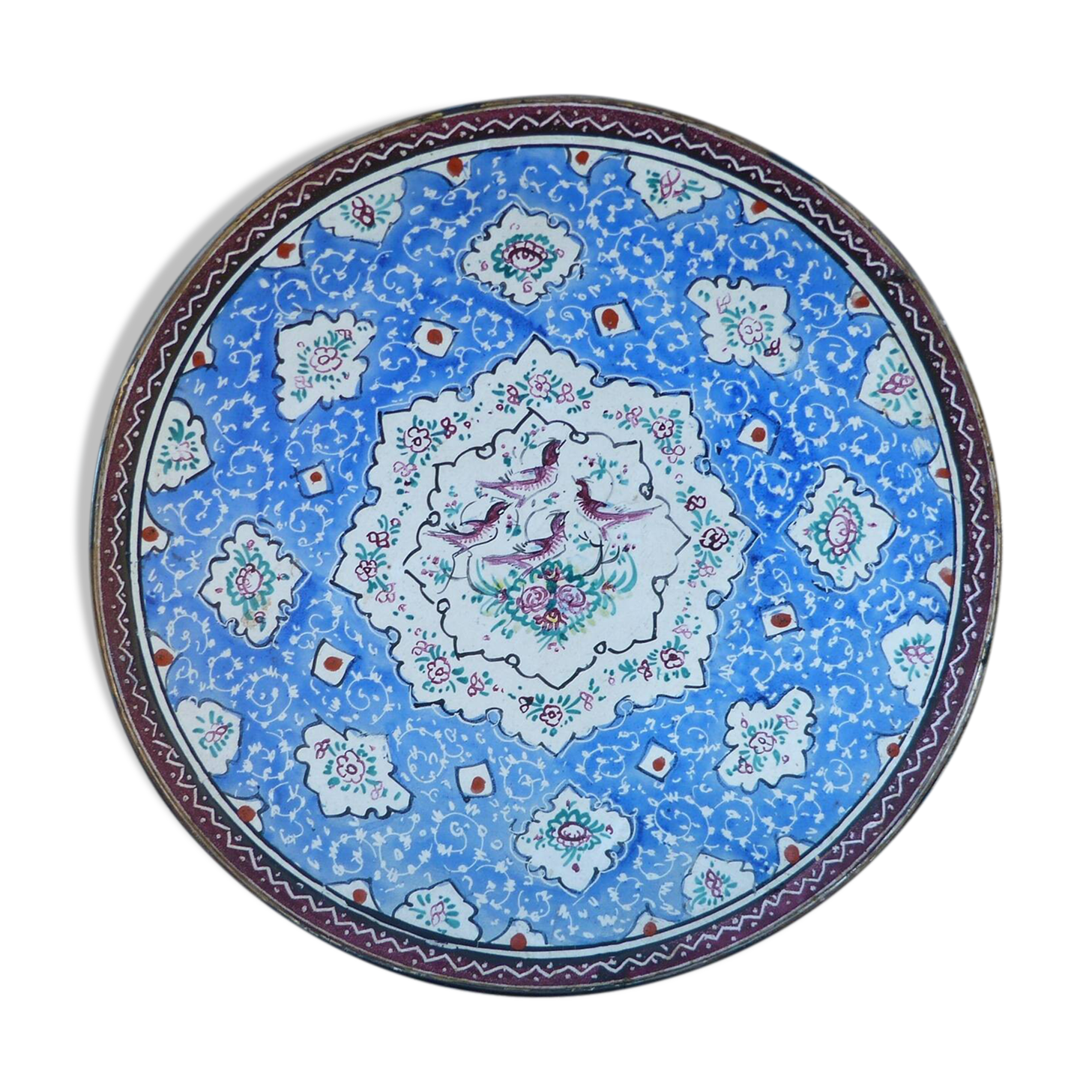 Decorative plate in blue enameled metal with bird motifs