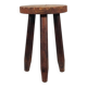 Vintage three-legged wooden milk stool in brutalist style with sculpted decoration.