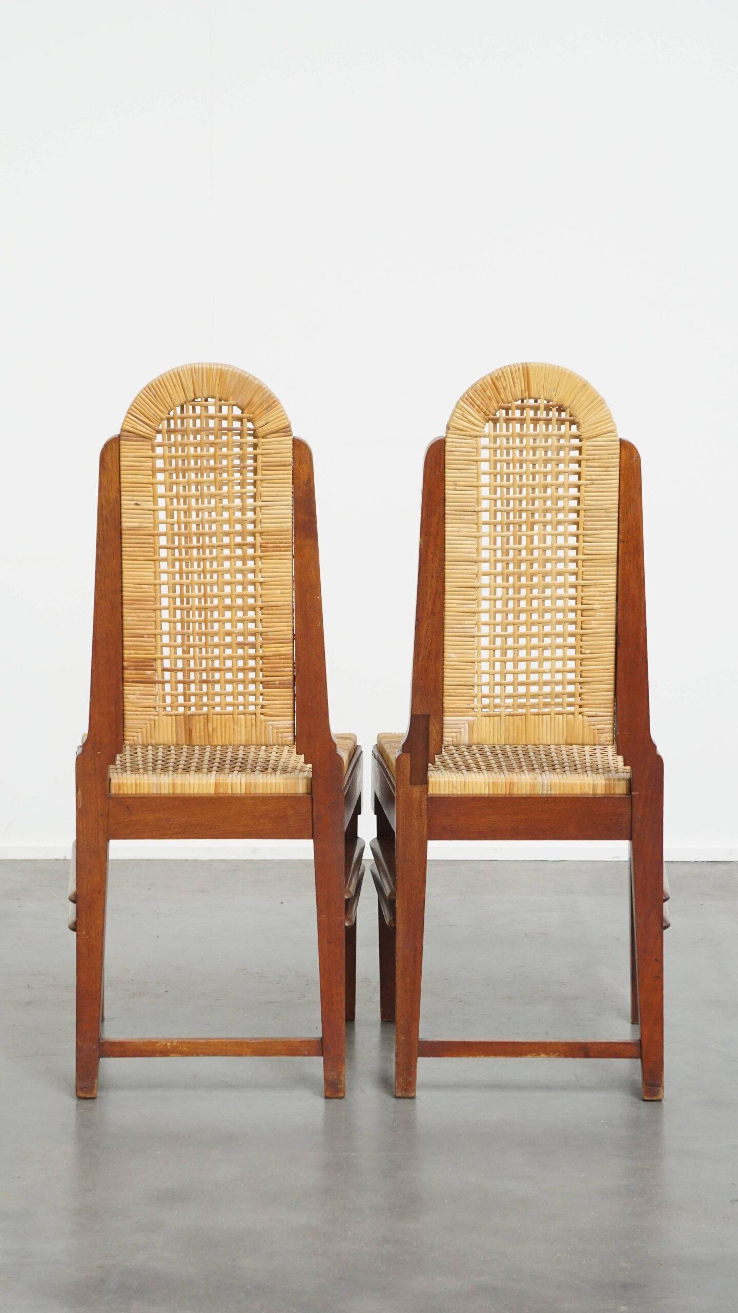 et of 6 wooden Art Deco design dining chairs with a wicker seat and backrest