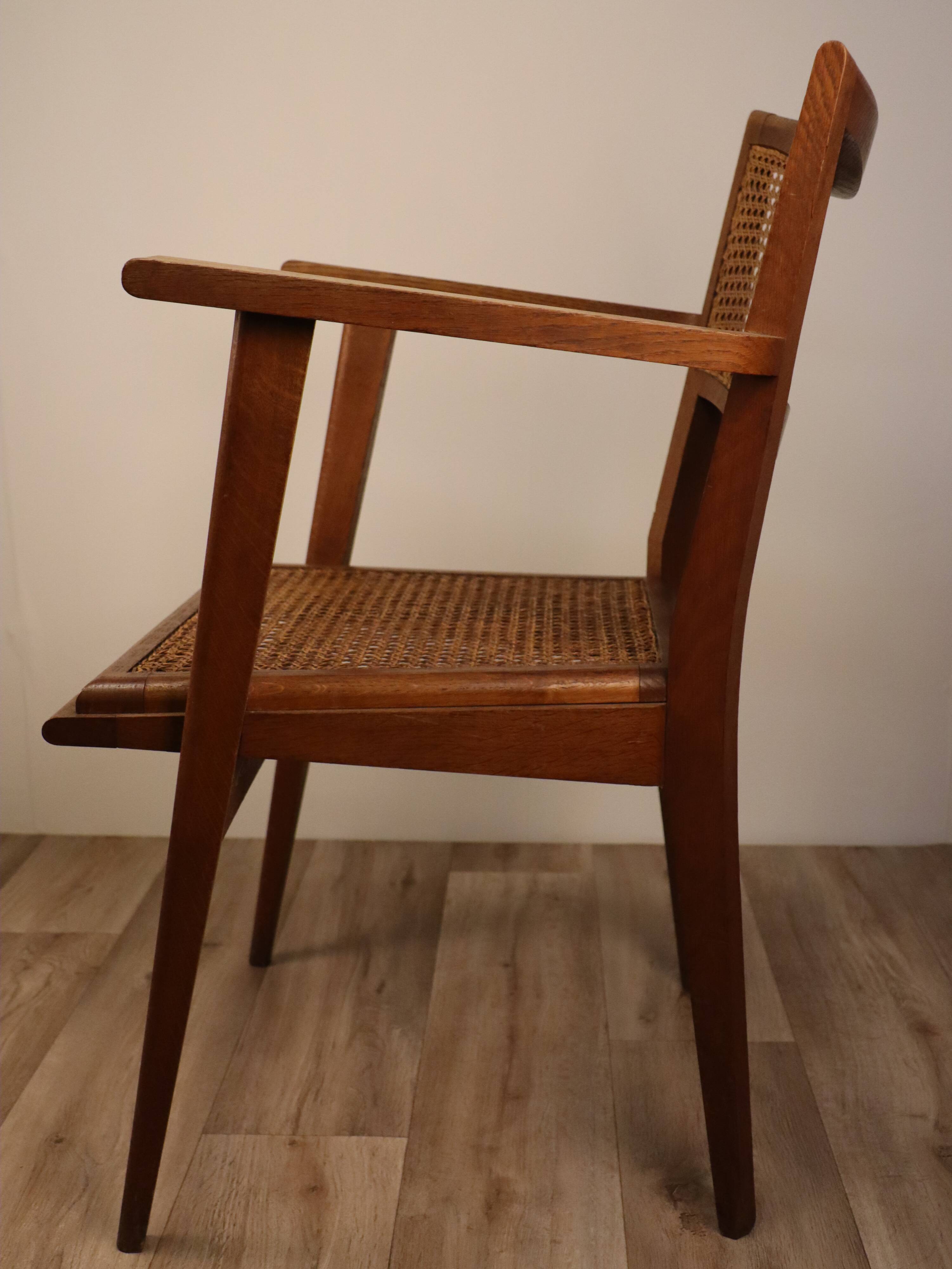 Vintage wooden armchair and canning 1950