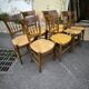 Set of 8 solid cherrywood chairs with straw seats, Directoire period