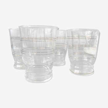 Four golden-edged glass cups