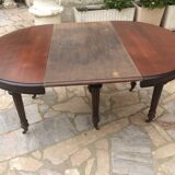 Oval table with extensions in massive mahogany napoleon III era.