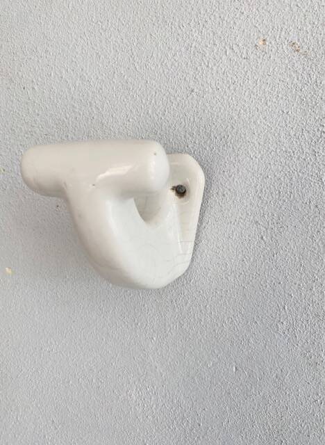 Enamelled earthen coat hook, 1900