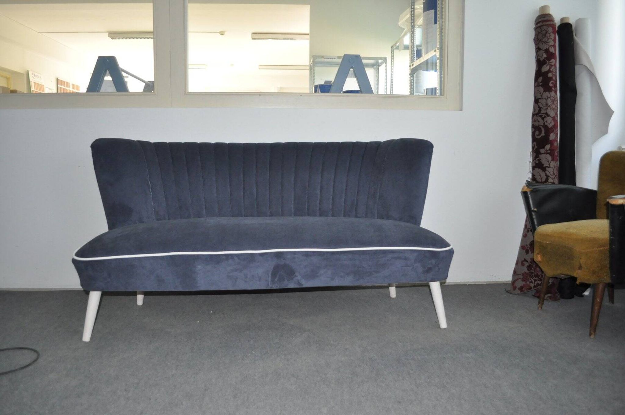 Blue fabric cocktail canapé with beech legs, 1950s style.