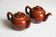 2 brown glazed ceramic teapots