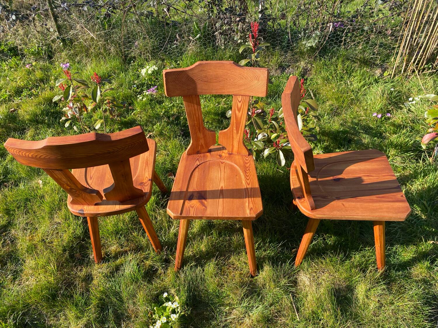 Three solid wood chairs