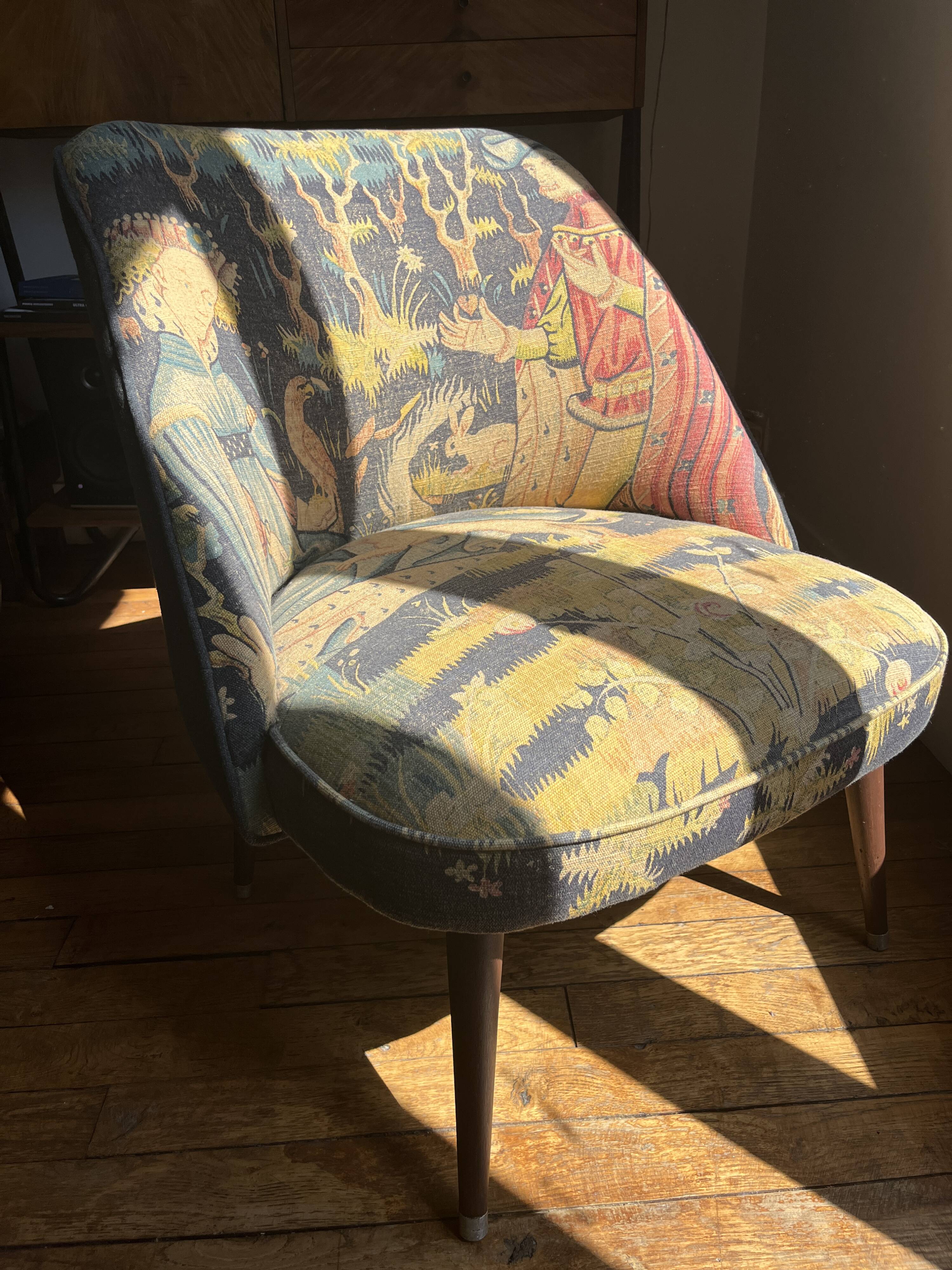 J. Tenreiro, Brazil. Concha armchair with tapered legs, Cluny tapestry 1400.