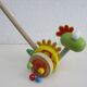 Push toy, wooden dinosaur. Brand: Bino