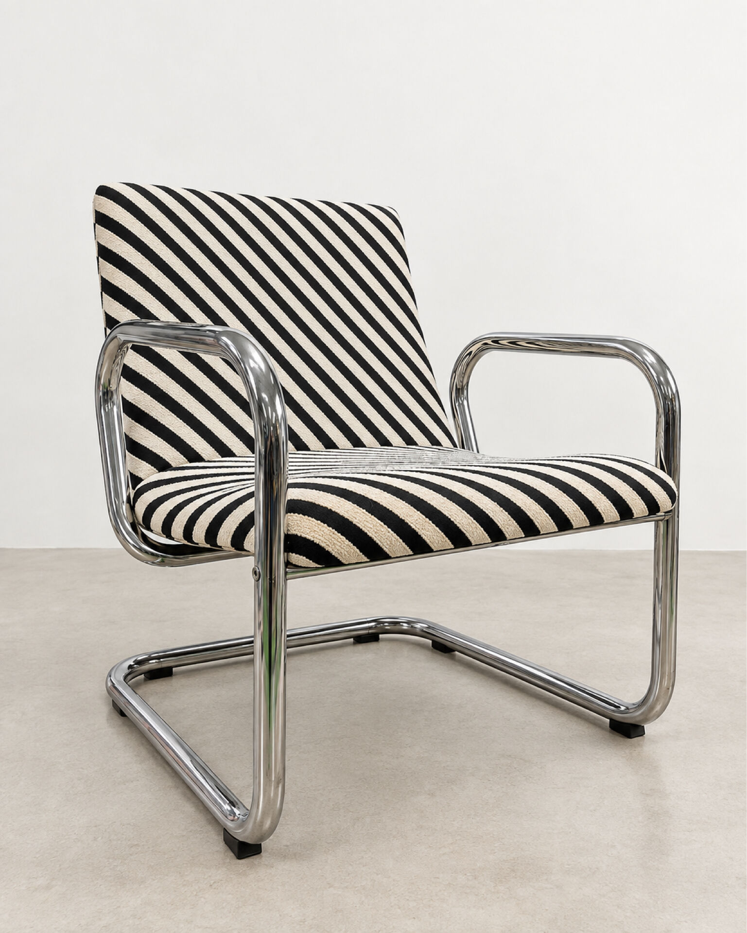 Restored vintage tubular chrome armchairs