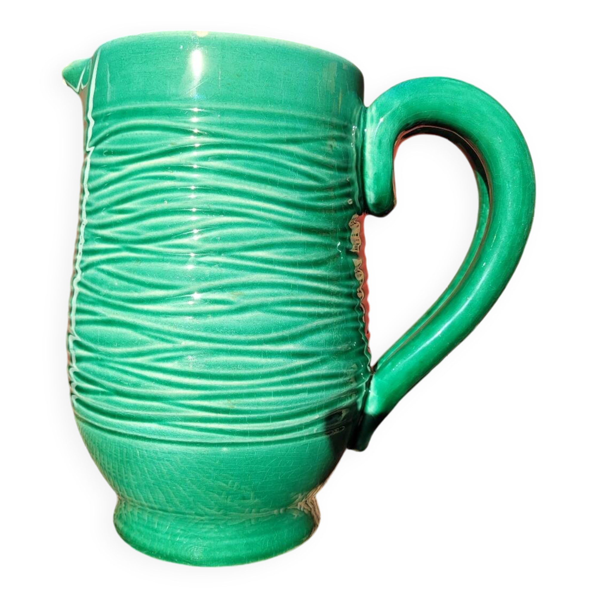 Green glazed ceramic pitcher