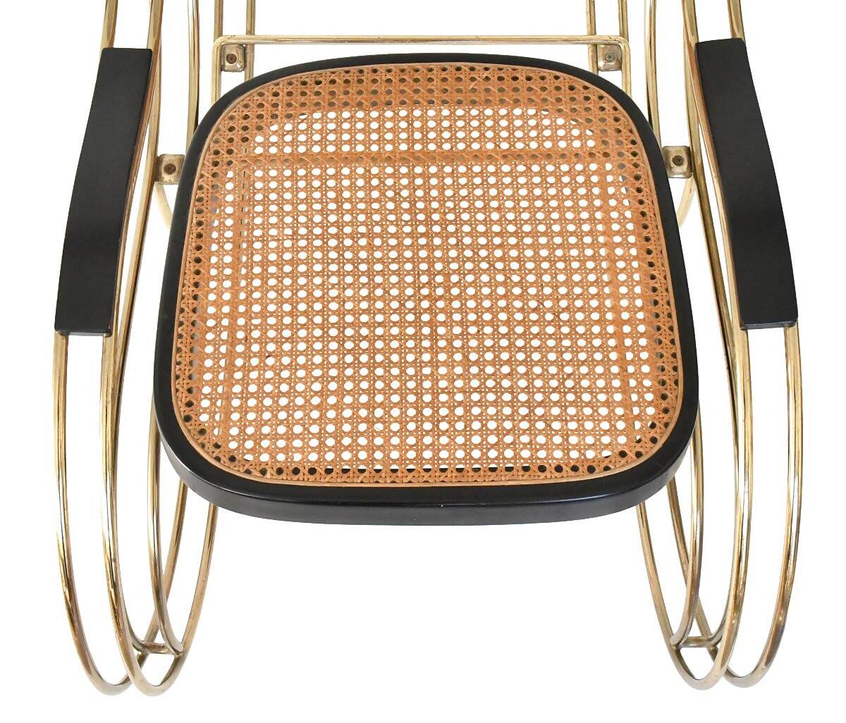 Modernist rocking chair in gilded brass and cane.