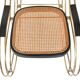 Modernist rocking chair in gilded brass and cane.