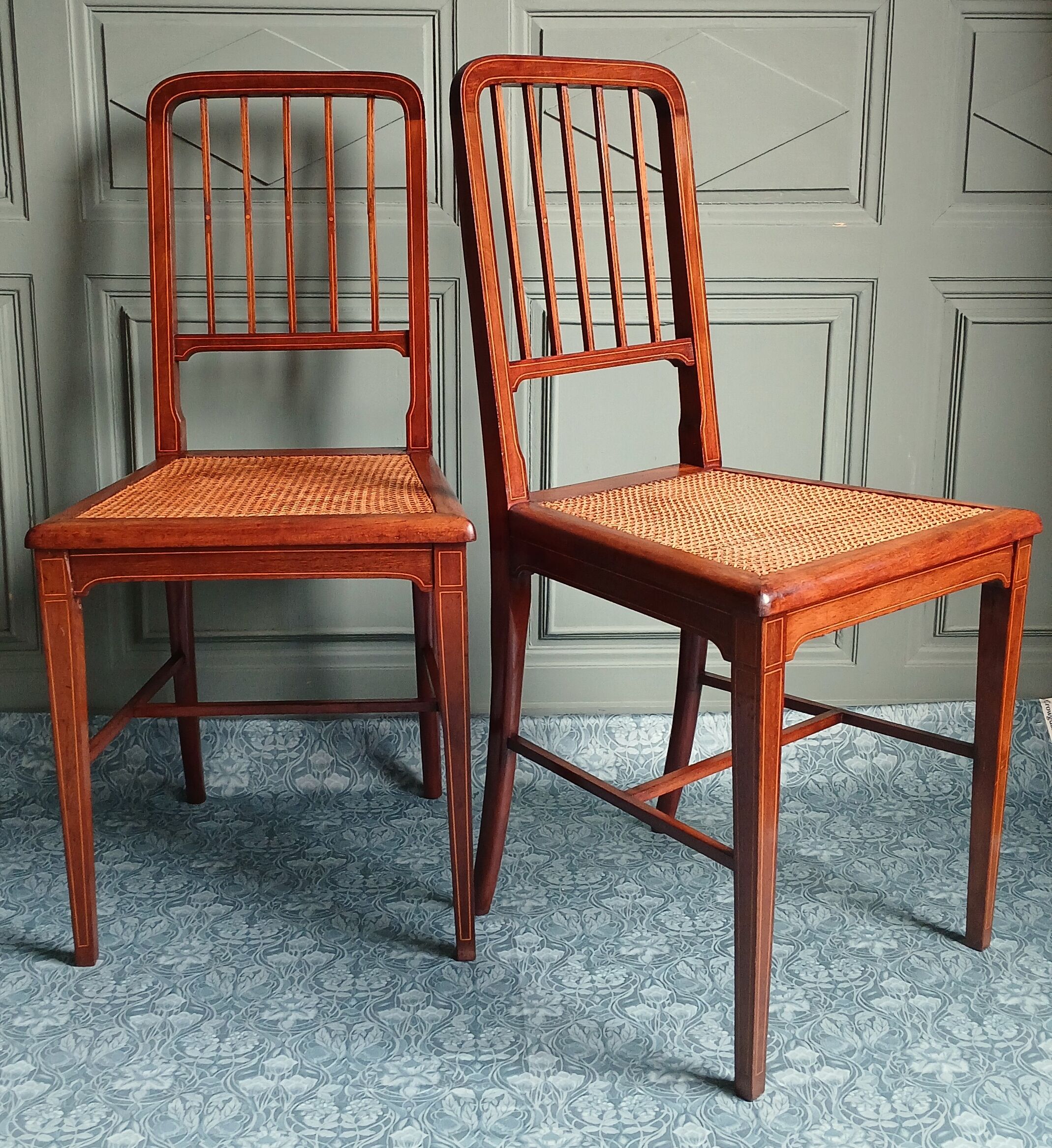 Pair of caned mahogany chairs, circa 1930.