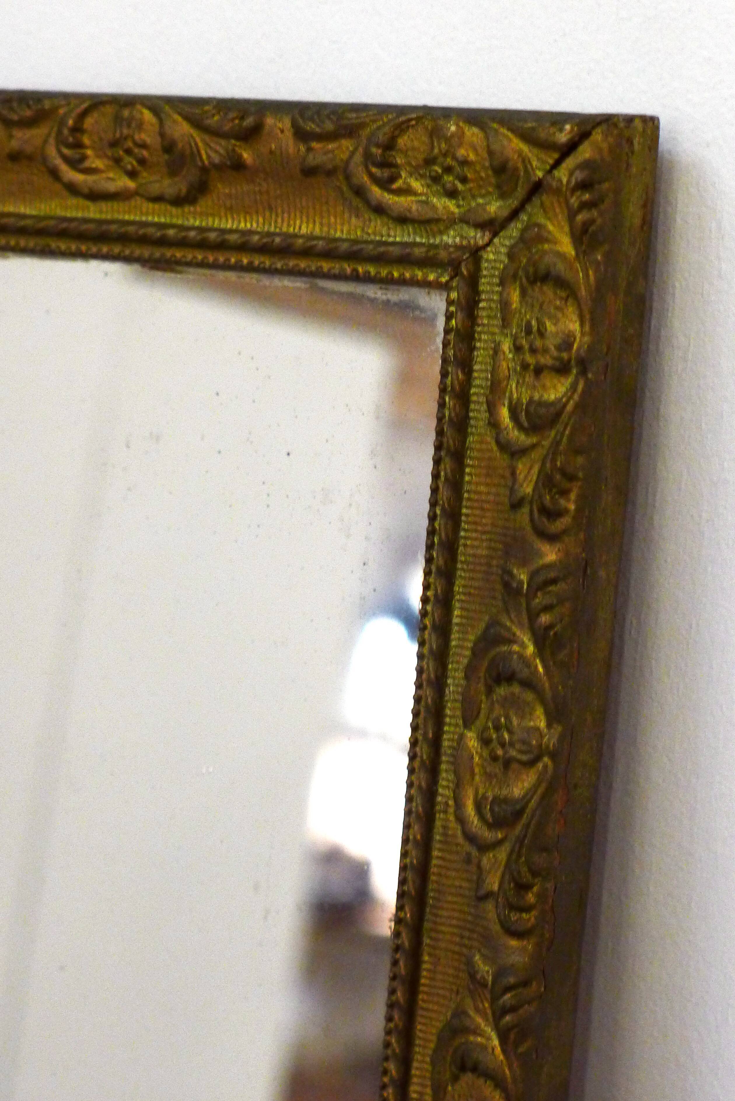 Large elongated gilded mirror
