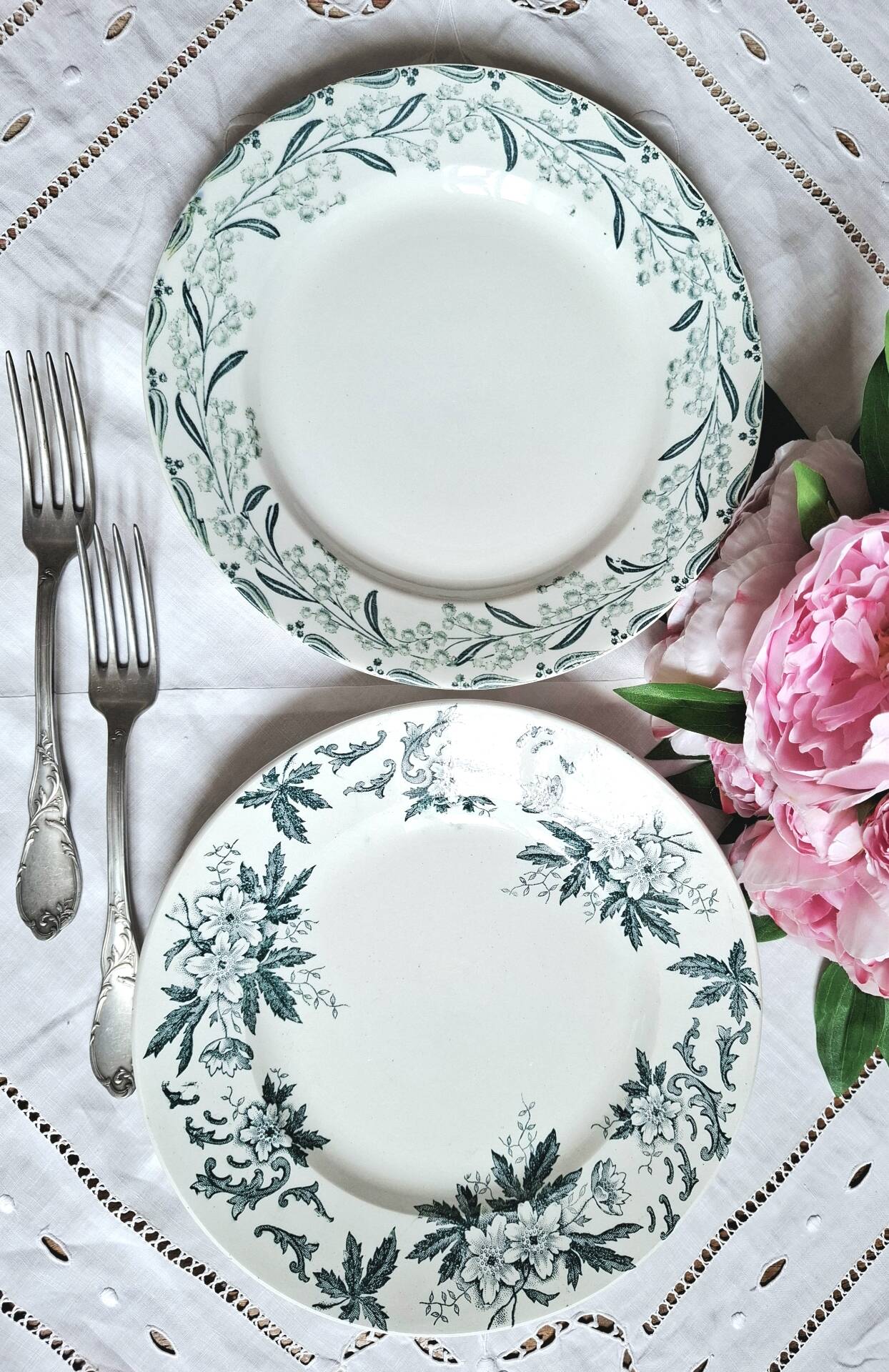 Old mismatched flat plates made of ironstone earthenware.