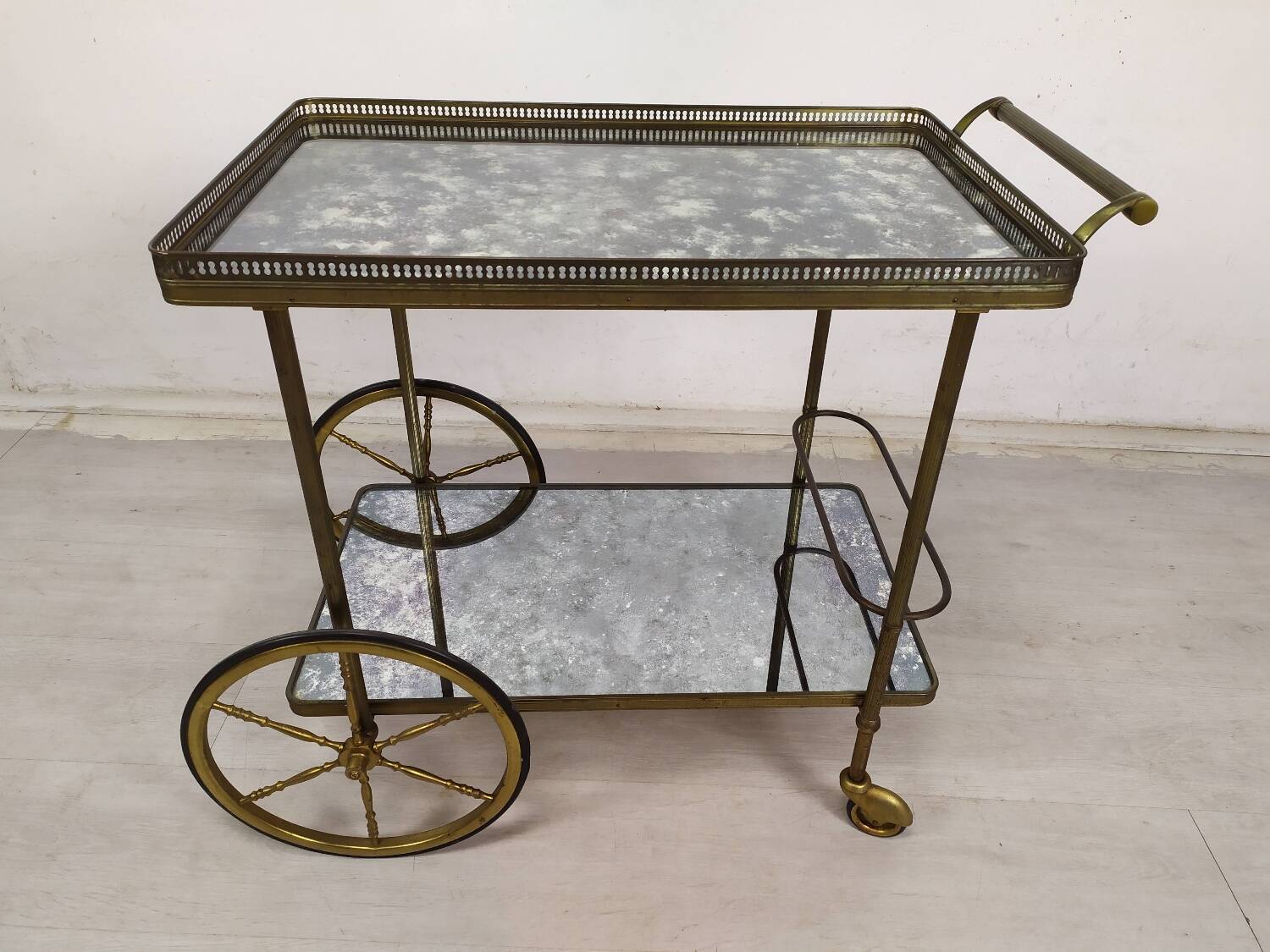 Brass and glass rolling trolley