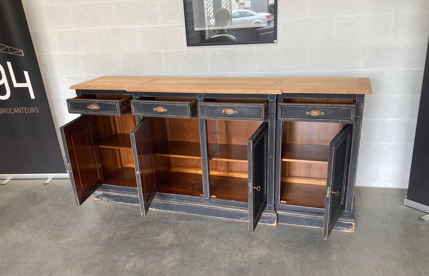 Old sideboard with four doors and four drawers