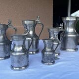 6 pewter pitchers