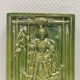 Carreau ancien en faïence verte, motif de Saint Georges et du dragon