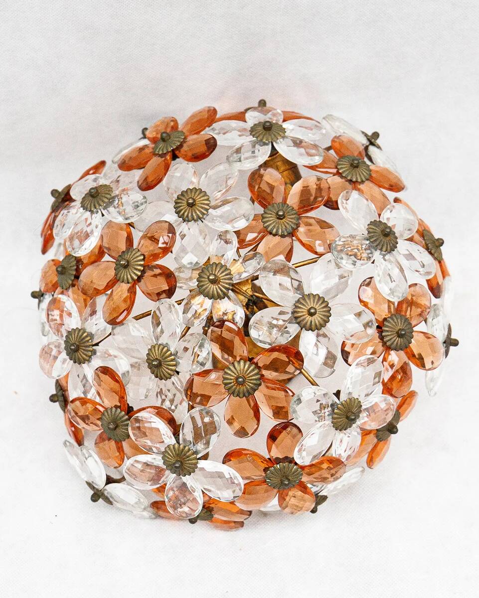 Ceiling light with transparent and peach flowers.