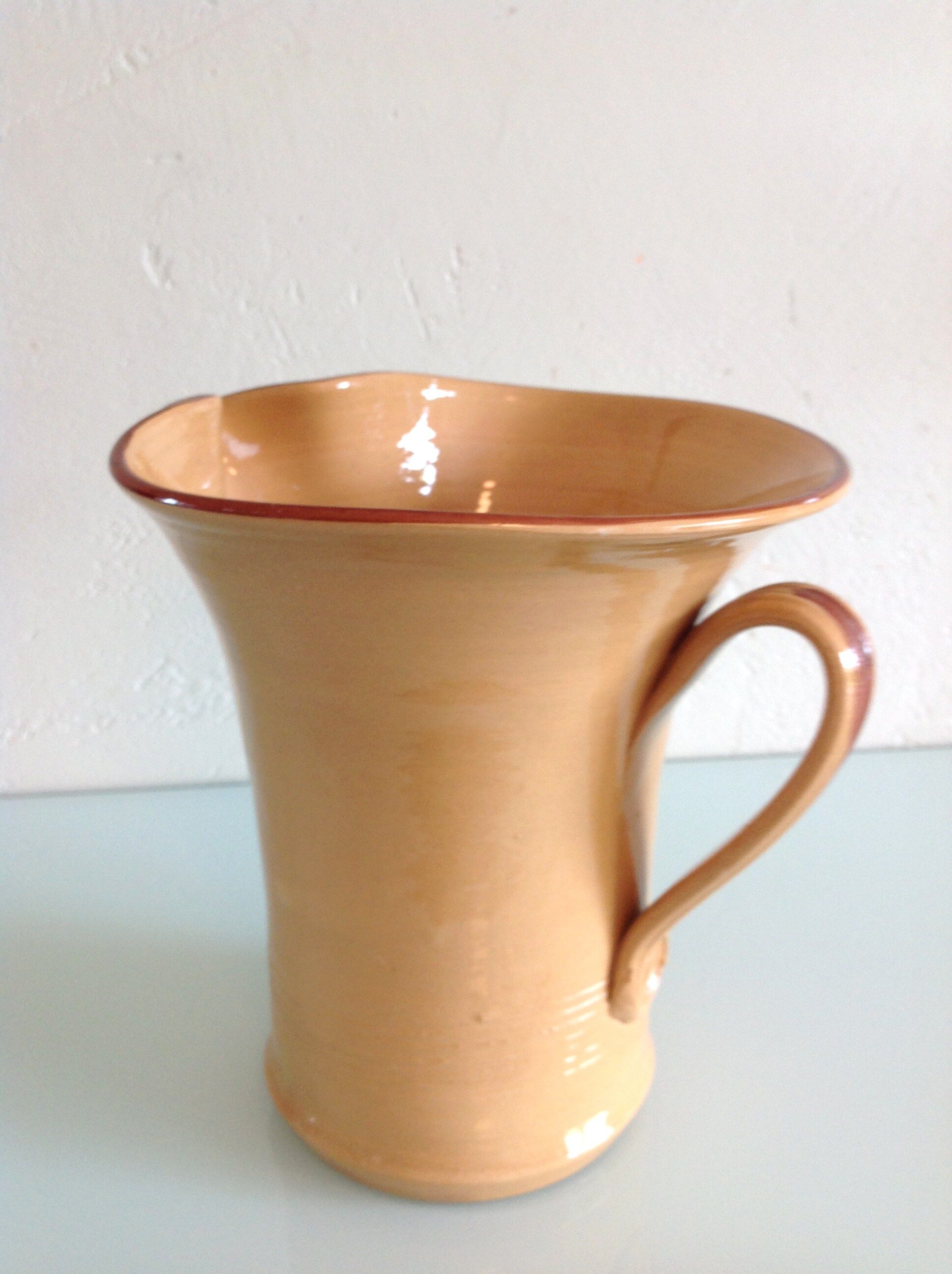 Pitcher in glazed ochre ceramic 50/60 years