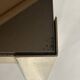 Set of three nesting side tables in brass and smoked mirror.