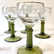 7 Alsace Roemer wine glasses, moss green stepped bases and gold trim.