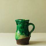 Glazed ceramic pitcher in green and brown by the potter Pierre Roulot.