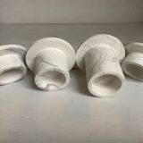 Four gypsum composite candle holders