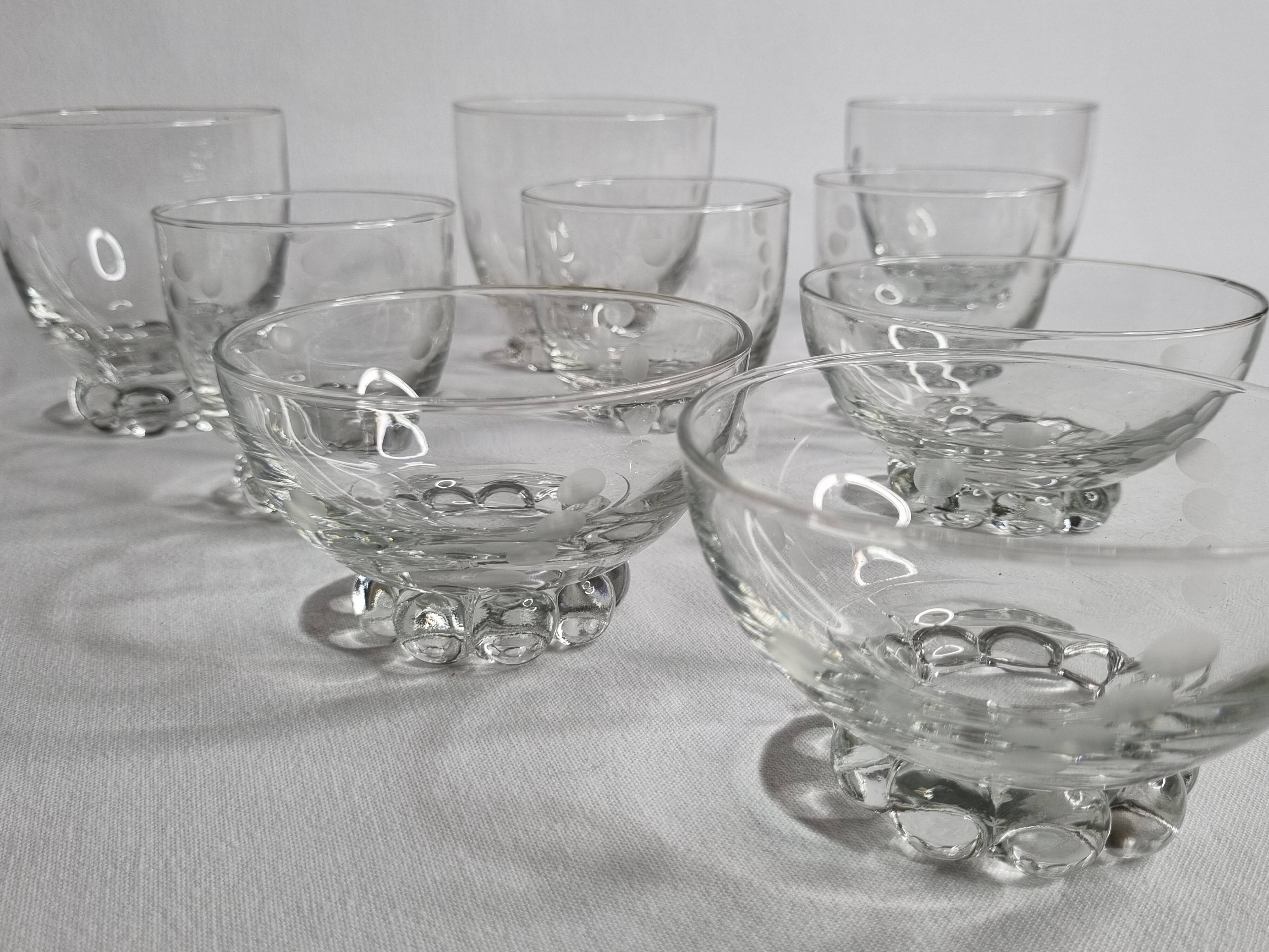 Set of Art Deco style engraved crystal bowls and glasses on spherical feet