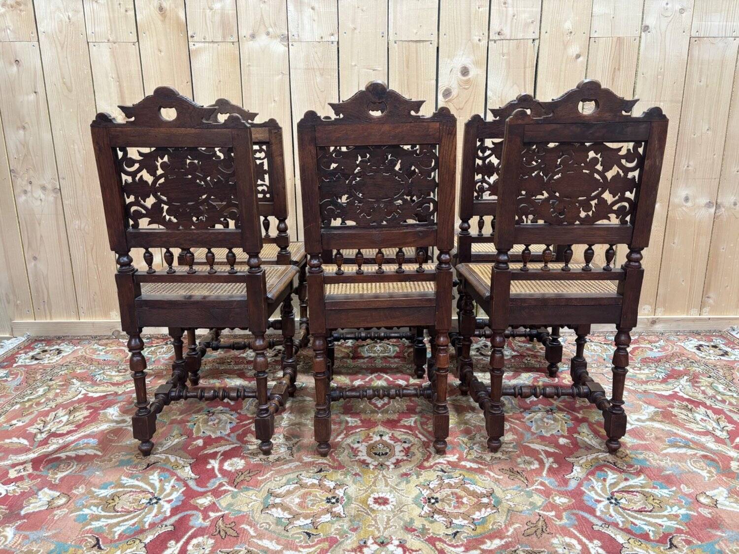 6 High Era chairs in carved solid oak and rattan caning.