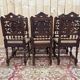 6 High Era chairs in carved solid oak and rattan caning.