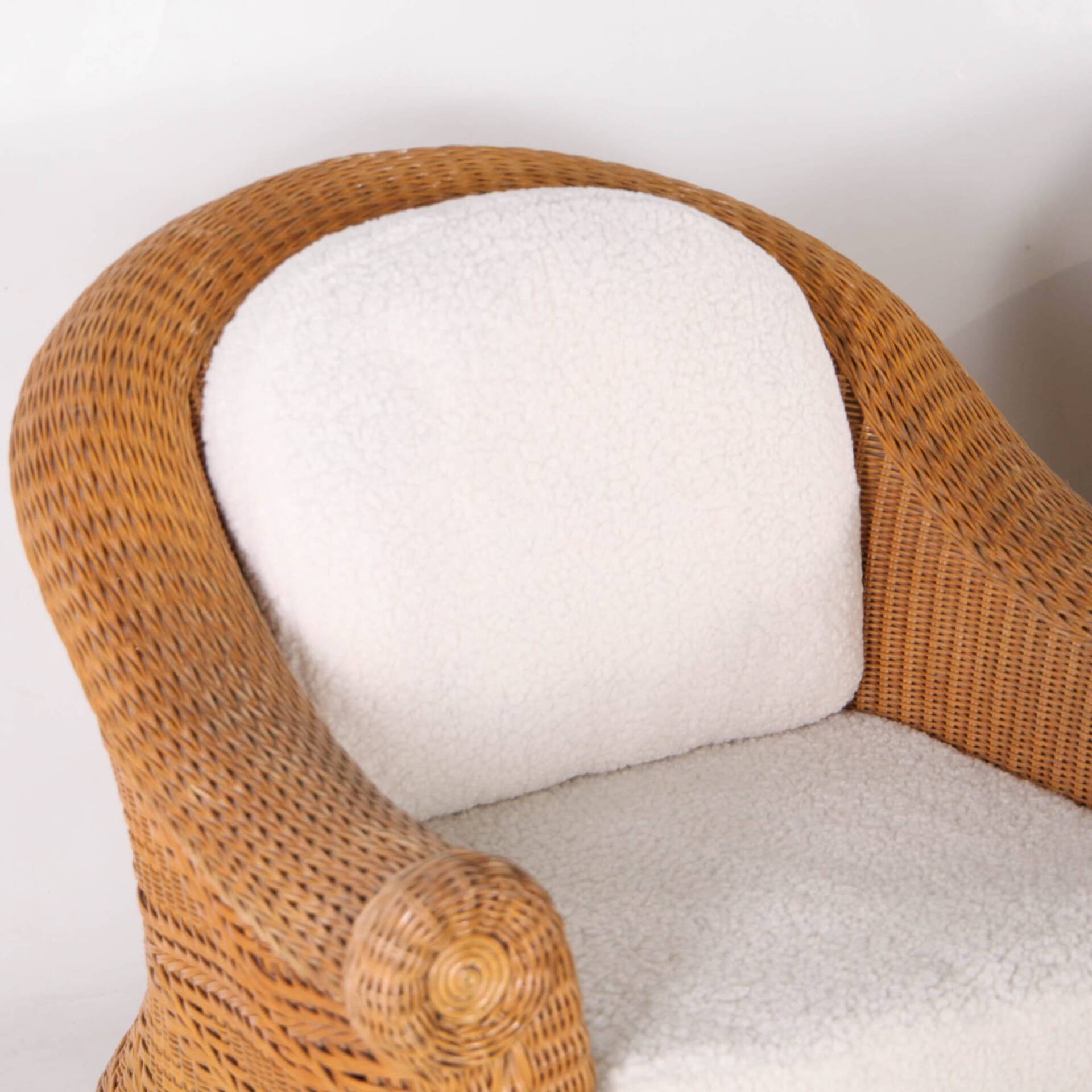 Pair of woven wicker armchairs