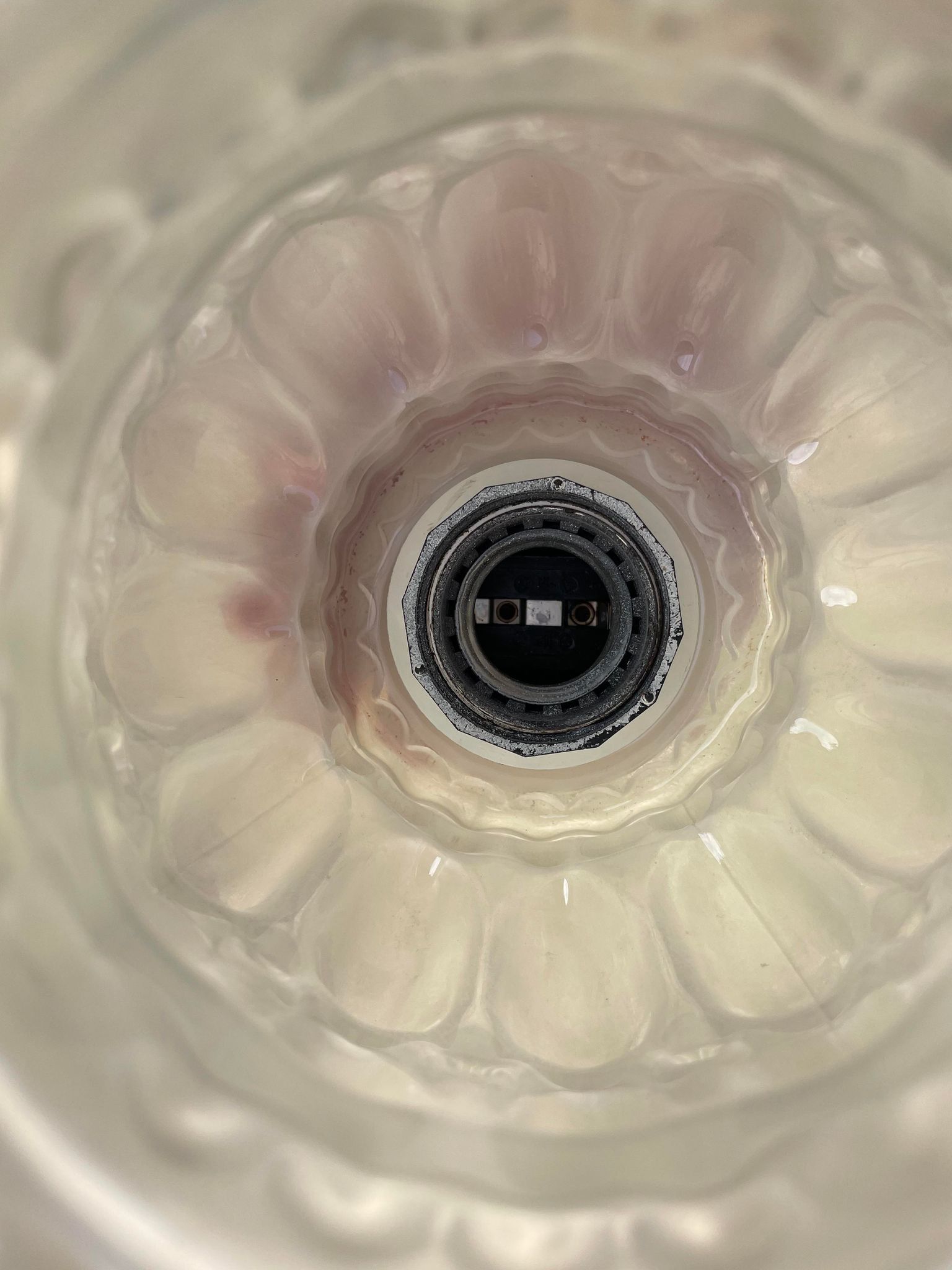 Suspension in bubbled frosted glass with its openwork entourage 70s